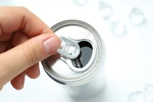 Yes, the hole in soda can tabs has a real purpose and it’s not originally for holding a straw