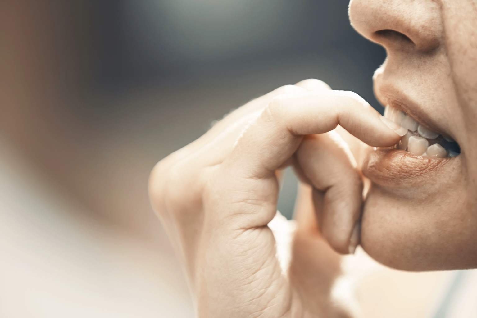 What does it mean when someone bites their nails according to psychology?